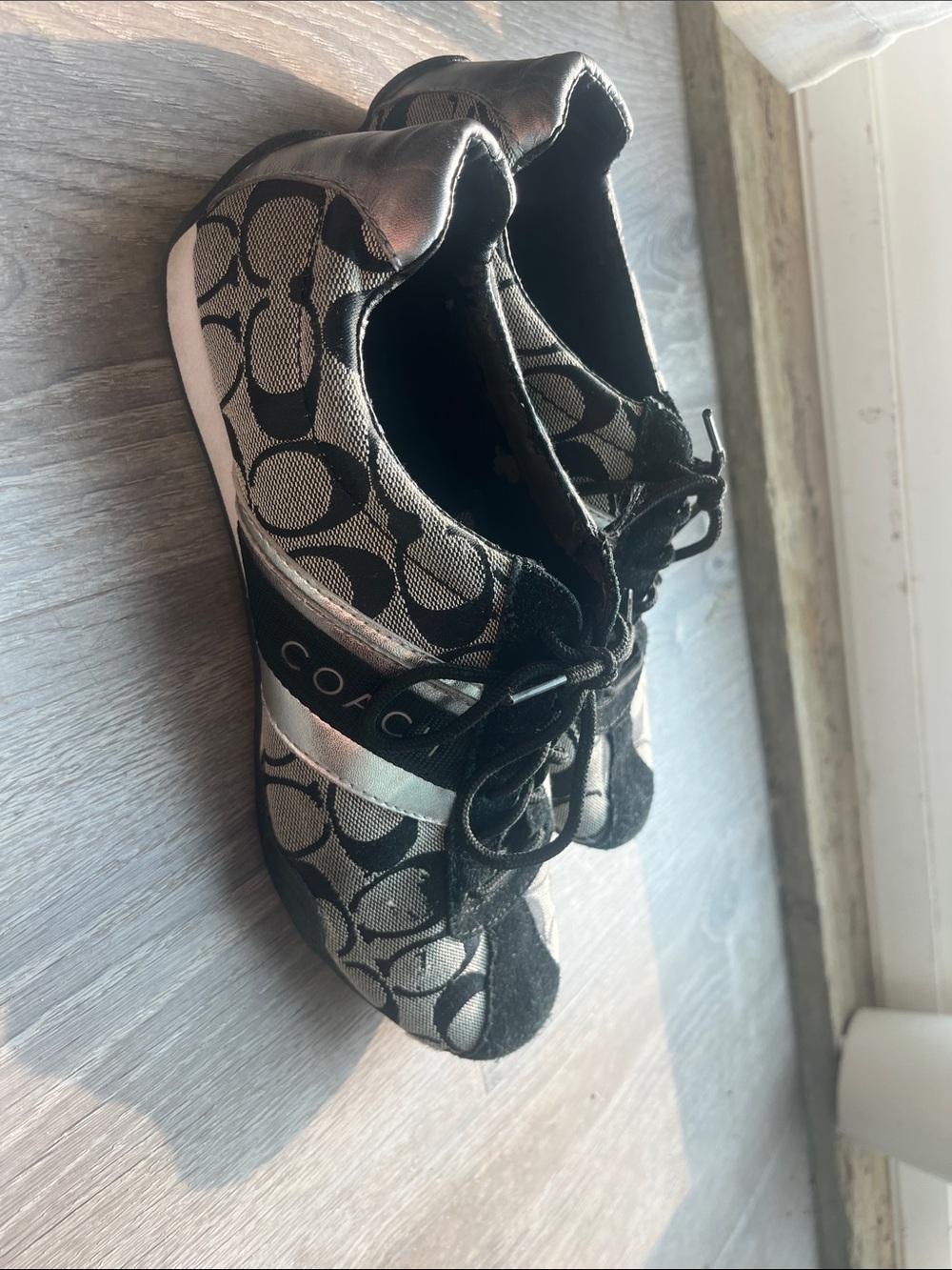Coach woman’s Black & Silver Signature Logo Sneakers